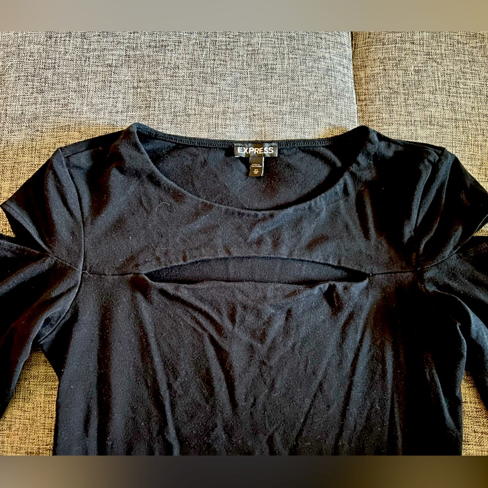 Cute black shirt w slits on sleeves and below neckline